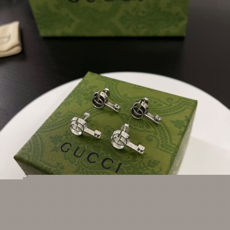 G*u*i earrings